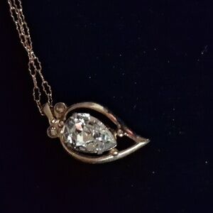 Goldtone open tear or heart shape pendant w a large crystal and fine Monet chain